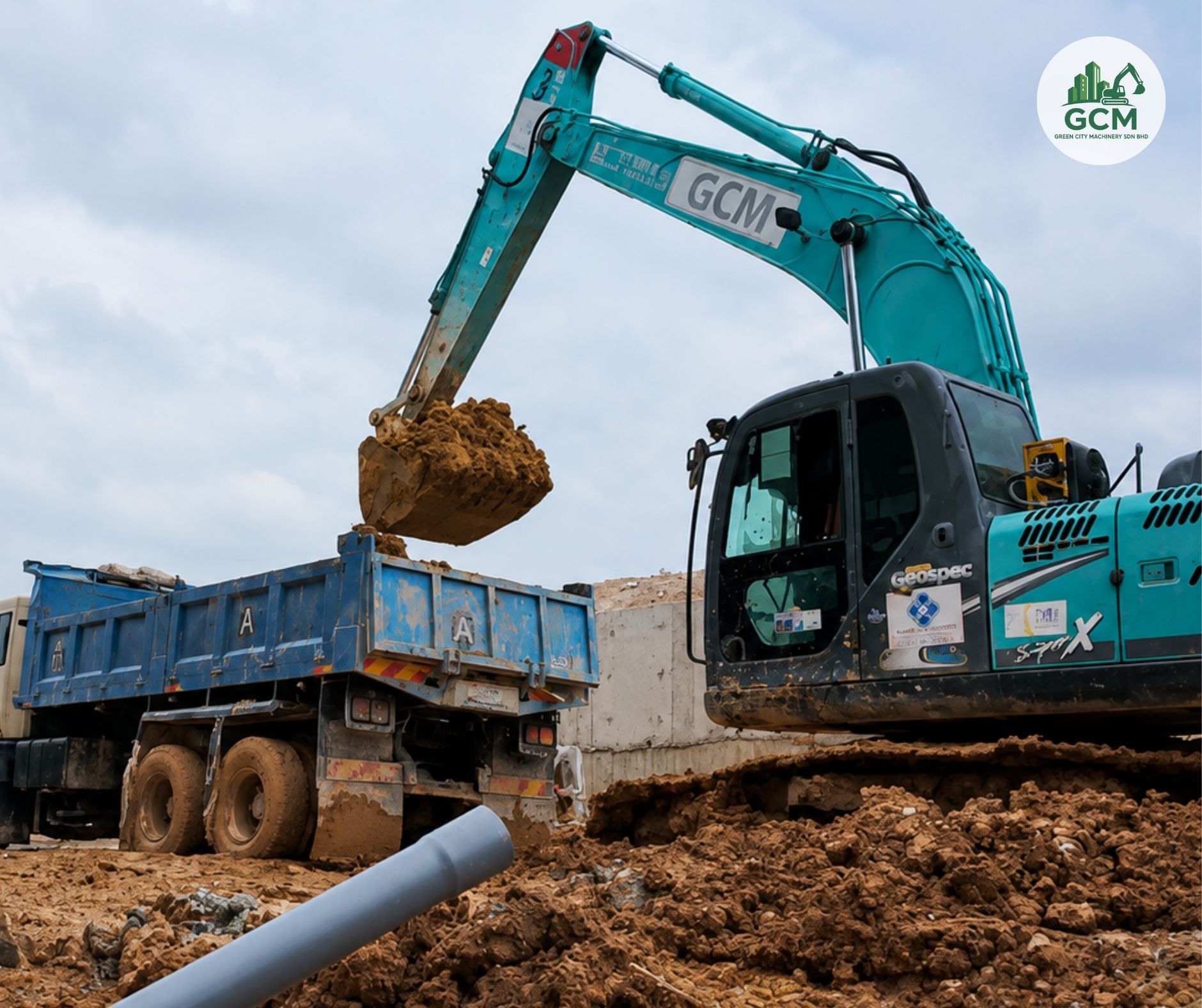 Excavator loading a lorry tipper on a data centre site at Sedenak Tech Park — Green City Machinery