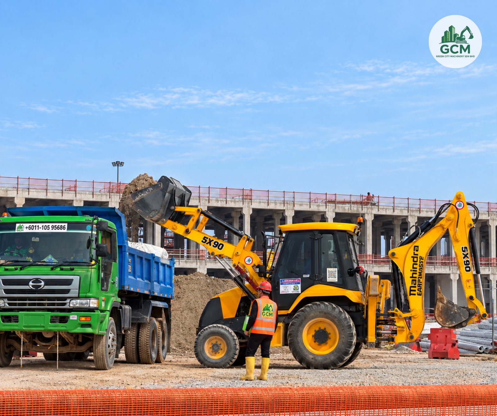 Backhoe loading soil into a lorry tipper at a data centre project site in Iskandar Puteri, Johor